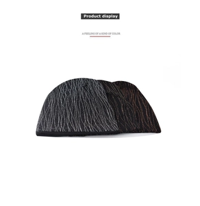 Close-up of black knitted beanie set featuring silver and gold metallic thread details
