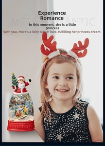 Christmas snow globe with Santa and reindeer displayed as a festive gift for kids