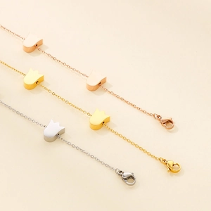 Detailed view of tulip charm bracelets in gold, rose gold and silver stainless steel