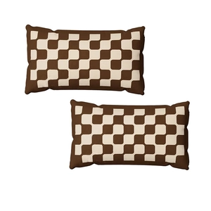Close-up of brown and beige checkerboard pattern on textured short plush cushion covers