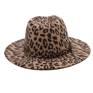 Close-up of leopard print wool fedora hat featuring a stylish gold metal buckle detail