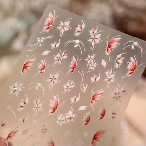 Floral and red butterfly nail stickers with 3D embossed texture and pearl accents