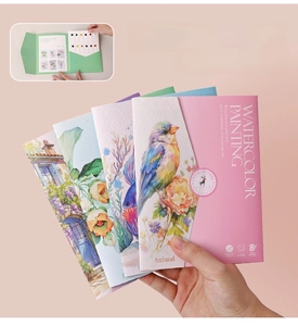 Portable watercolor painting kit with 12 solid colors and artistic themed cover illustrations