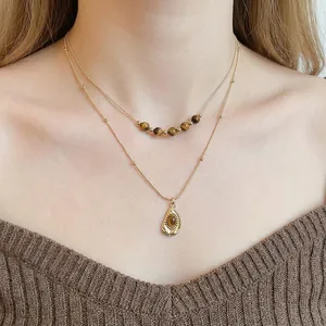 Double-layered gold necklace with tiger eye stone flower pendant for women