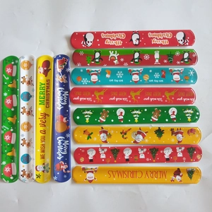 Detailed top view of 12 festive Christmas slap bracelets with various colorful patterns