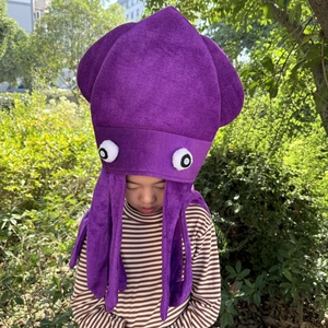 Detailed texture of purple plush octopus hat with cartoon eyes and tentacles for parties