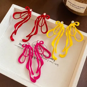 Colorful ribbon bow earrings with sparkling rhinestones in red, yellow and rose pink colors