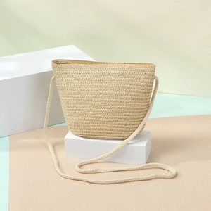 Close-up of handmade straw woven bag texture with zipper and summer beach design