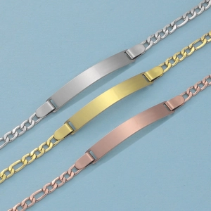 Detailed view of silver, gold, and rose gold stainless steel ID bracelets for kids
