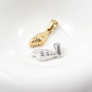 Vintage gold and silver conch shell pendants made of durable stainless steel in a bowl