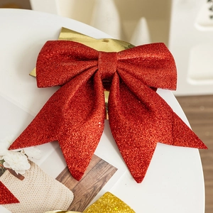 Large red glitter Christmas bow with sequins for tree decoration and holiday window display