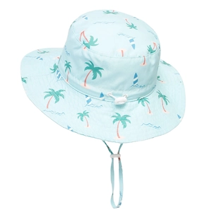 Close-up of kids light blue sun hat with tropical coconut tree and surfboard patterns