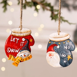 Detail of resin Christmas glove ornaments with Let It Snow and Ho Ho Ho text and rustic rope