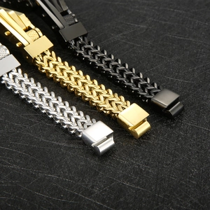 Detailed close-up of dragon bone chain bracelets in silver, gold, and black stainless steel