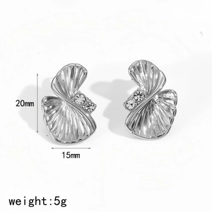 Detailed view of silver scalloped earrings with zircon inlays and 20mm x 15mm dimensions