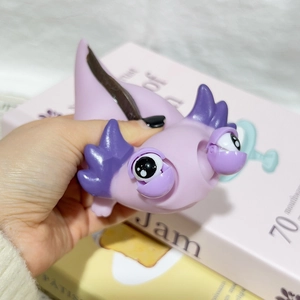 Funny purple axolotl squeeze toy with popping eyes for stress relief and sensory play