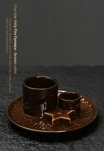 Macro detail of brown ceramic incense burner with five-star accessory and carved base