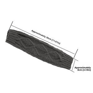 Detail of dark grey knit arm warmer showing diamond texture and 30cm length measurements