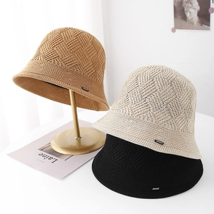 Minimalist knit bucket hat for women in khaki, beige, and black with subtle texture