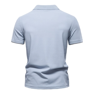 Back view of light blue polo shirt showing the breathable piqué fabric and ribbed hem