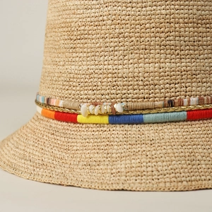 Handmade raffia sun hat for women with colorful yarn trim and shell accents for summer