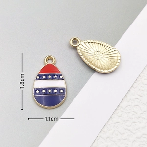 Detailed view of 1.8cm x 1.1cm US flag egg pendant with red, white and blue enamel finish