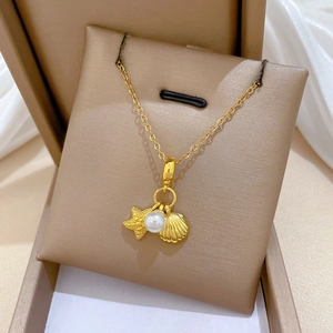 Detailed view of titanium steel necklace with starfish, pearl and shell pendants