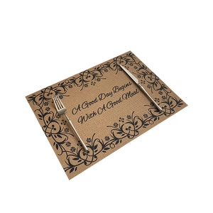 Floral print faux jute placemat with cutlery set on white background