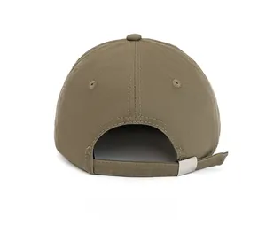 Detail of khaki cotton baseball cap with adjustable silver metal buckle and fabric strap