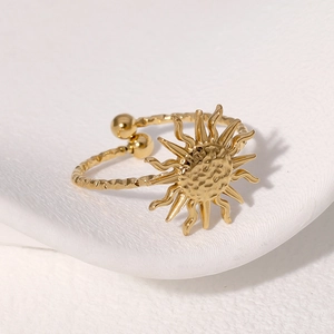 Minimalist golden sun ring with hammered texture and adjustable twisted band design