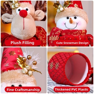 Close-up of Christmas gift boxes with Santa, snowman and reindeer plush details