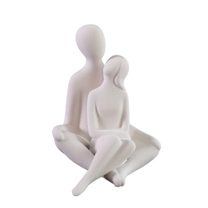 Modern minimalist ceramic couple embrace sculpture with white matte finish for home decor