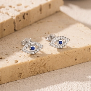 Exquisite S925 sterling silver evil eye stud earrings with blue gems and clear crystals