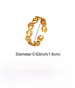 Macro shot of adjustable gold stainless steel cat paw cutout ring detail and dimensions