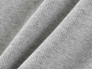 Close-up of soft grey knitted fabric detail showing texture and elasticity for yoga shorts
