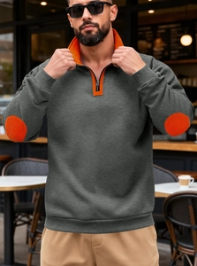 Close-up of men's dark grey sweatshirt featuring orange contrast elbow patches and zipper