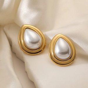 Elegant 18K gold plated teardrop pearl stud earrings displayed on white marble stone
