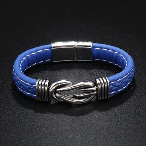 Close-up of blue braided leather bracelet with silver infinity charm and magnetic clasp