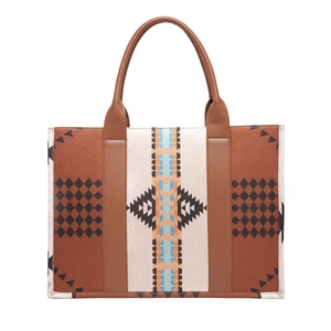 Detail of bohemian tote bag with geometric print, canvas texture and brown leather handles