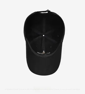 Detail view of the black cotton baseball cap interior structure and adjustable buckle