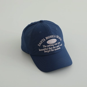 Close-up of navy blue quick-dry baseball cap with vintage Santa Monica Beach embroidery
