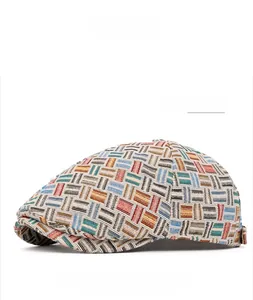 Detailed view of multicolored geometric woven texture on a vintage flat cap in light blue