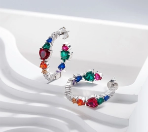 Detailed close-up of S925 silver hoop earrings with multicolored heart zircon stones