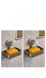 Detail view of suction cup soap dish showing the vacuum pressure button for easy installation