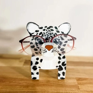 Detailed view of a hand-painted leopard wooden glasses stand for office desk decor