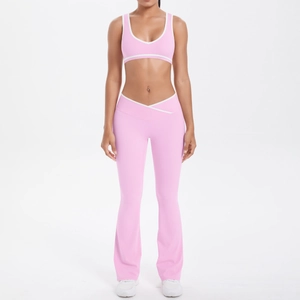 Pink yoga set with U-neck bra and V-cross high waist flared pants featuring white piping