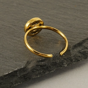 Detailed view of 18k gold plated adjustable ring with unique smiley face hollow carving