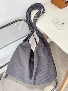 Minimalist grey pleated hobo bag with adjustable strap for commuting and daily wear