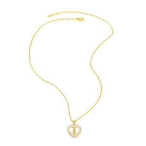 Golden heart pendant necklace with Virgin Mary relief and crystal stones on white background
