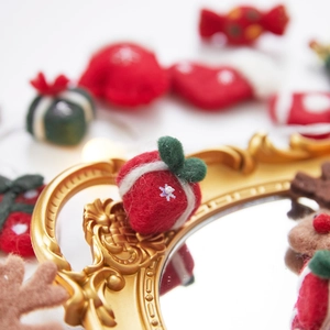 Handmade wool felt Christmas tree decorations including red gift box and festive charms